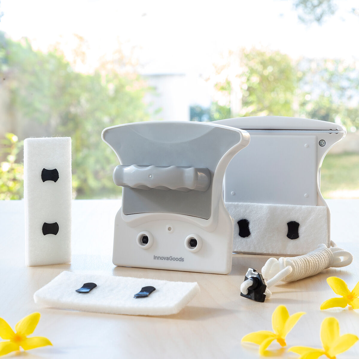 Product components with the Magnetic Window Cleaner parts and pads laid out in a bright, clean environment. Highlights the interchangeable pads and secure design.