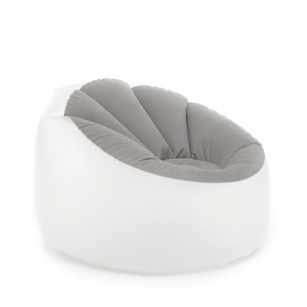 A close-up shot of the inflated armchair, showing its soft gray and white design. The armchair is presented in a plain setting, emphasizing its shape and texture.