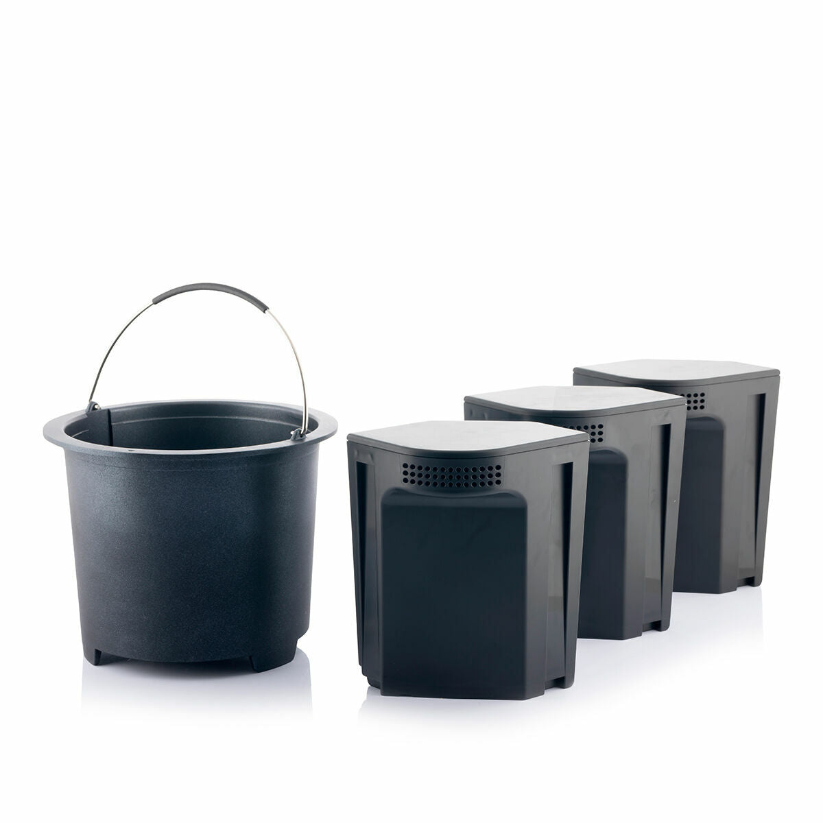 Three black containers and a bucket, likely used for the collection or processing of compost material.