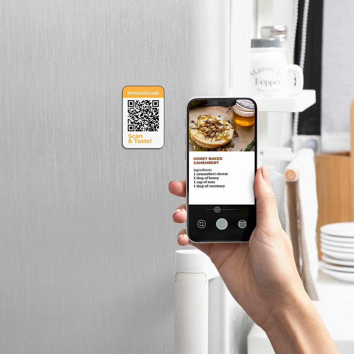 A QR code on a fridge is scanned by a smartphone displaying a recipe.
