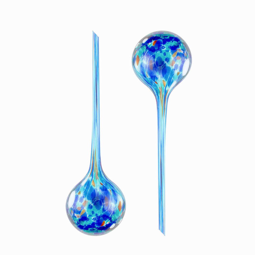 Close-up of the two watering globes, showcasing the intricate design and the shape of the stems.