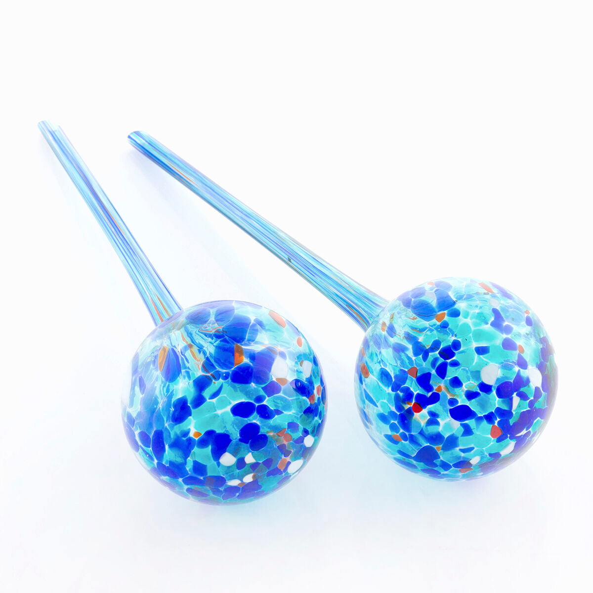 Two decorative watering globes made of glass with multicolored patterns against a plain white background.