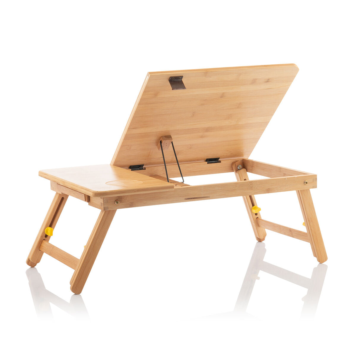 The bamboo table viewed from the back, showing its adjustability and tiltable surface on a white background.