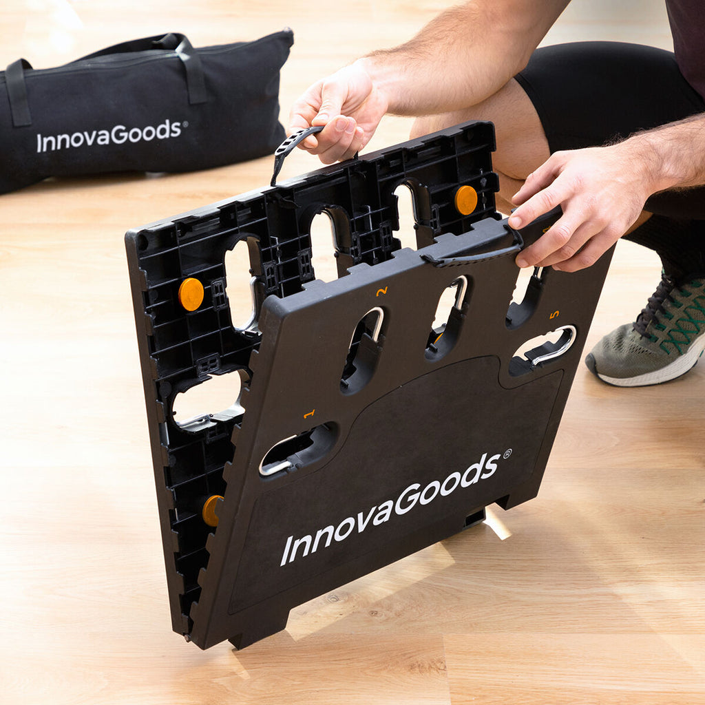 A user is folding the exercise board, emphasizing its portability and ease of assembly. The branded storage bag is nearby.