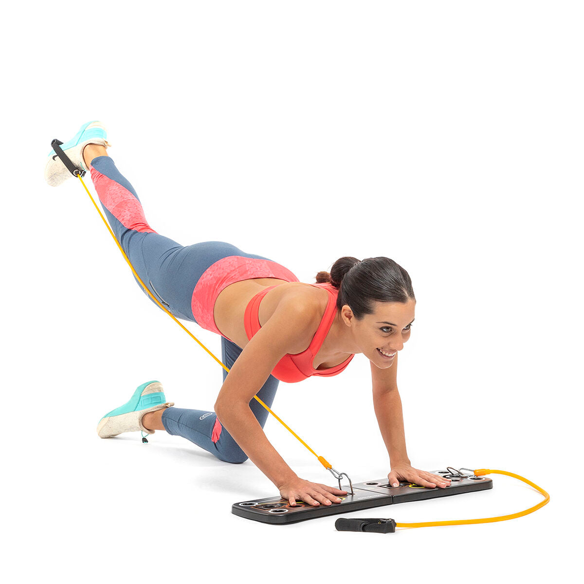 A person stretching and using the resistance bands while kneeling on the push-up board in a dynamic pose.