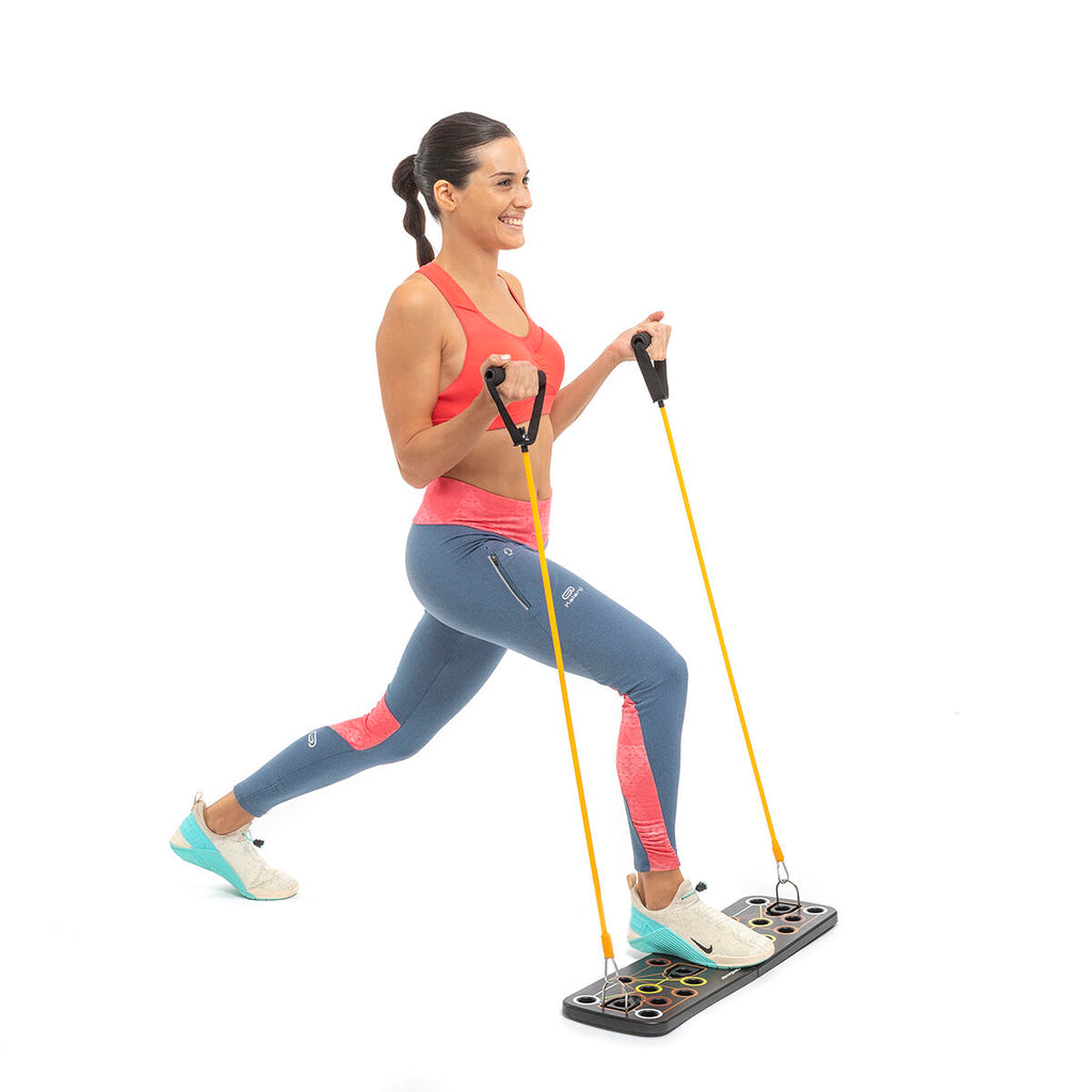 A person using the push-up board in a lunge position, demonstrating a full-body resistance band workout.