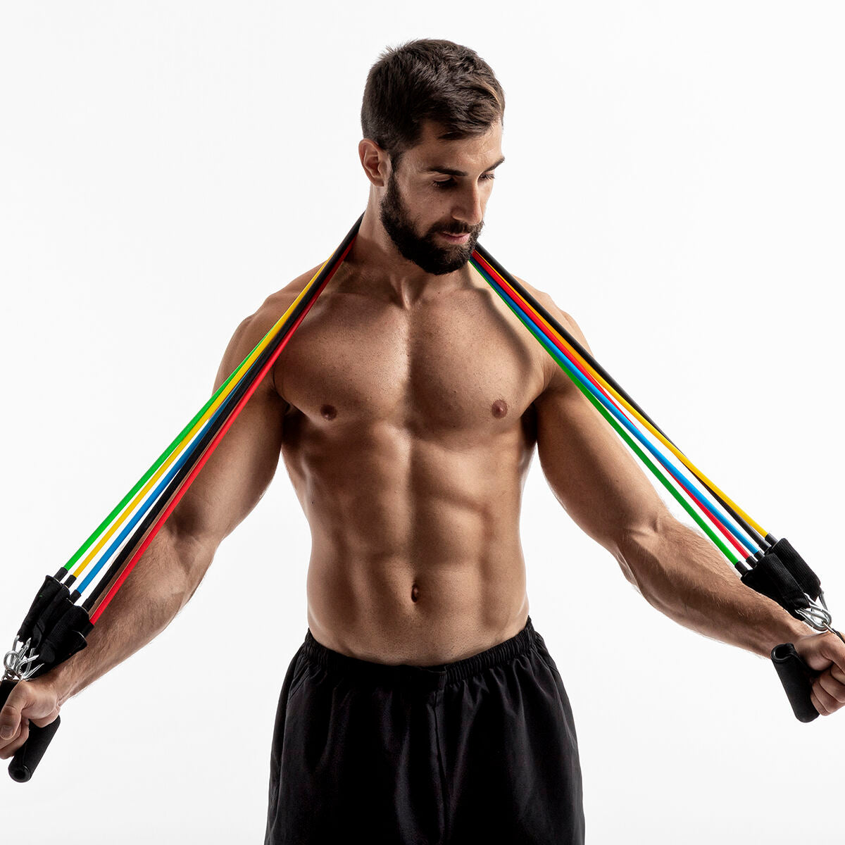 A male user demonstrating an exercise with the bands over his shoulders, highlighting their flexibility.