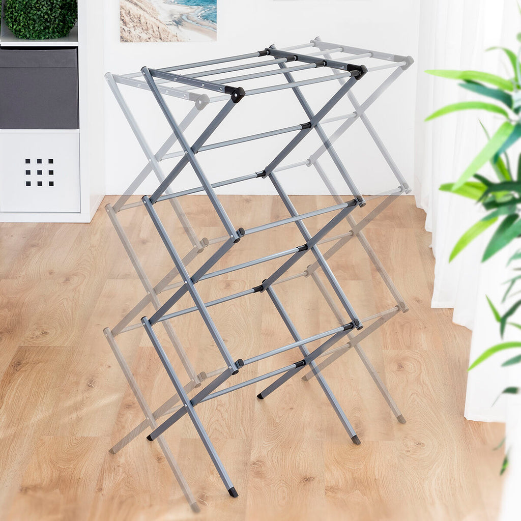 Transparent effect showing the different expandable positions of the metal clothes dryer in a room setting.