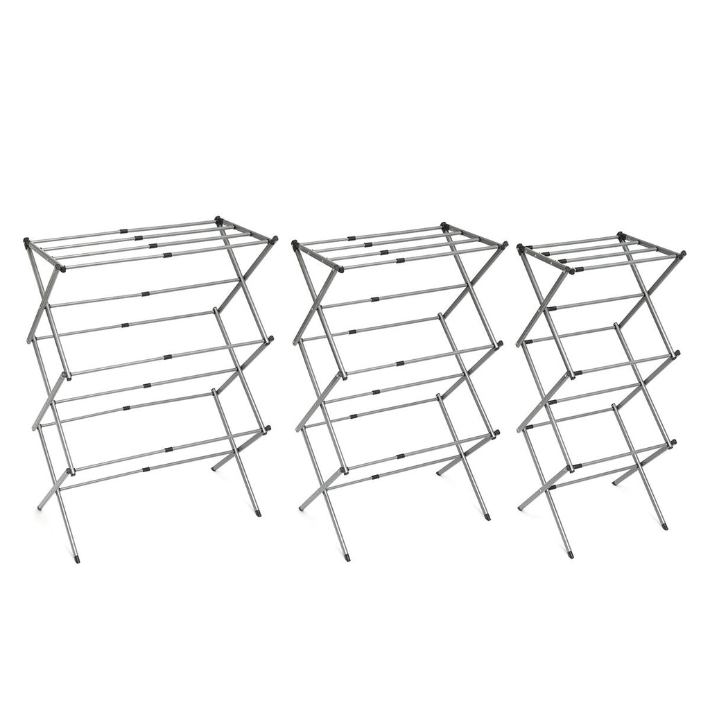 Three fully opened metal clothes dryers side by side displaying different levels of expansion.