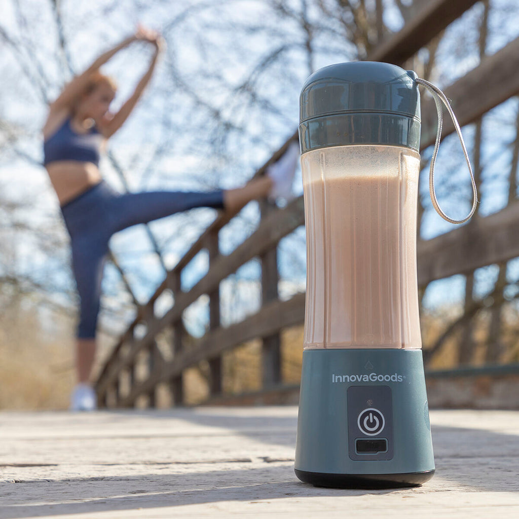 The blender is shown standing on a bridge with a fitness scene in the background, highlighting its portability and post-exercise use.
