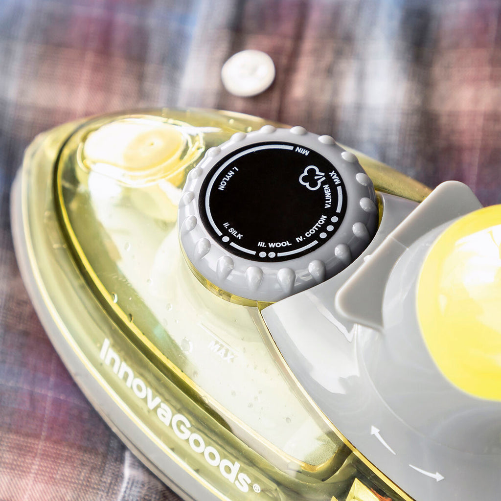 A top-down view of the iron's fabric setting dial showcasing various settings for different fabrics, alongside Innovagoods branding.