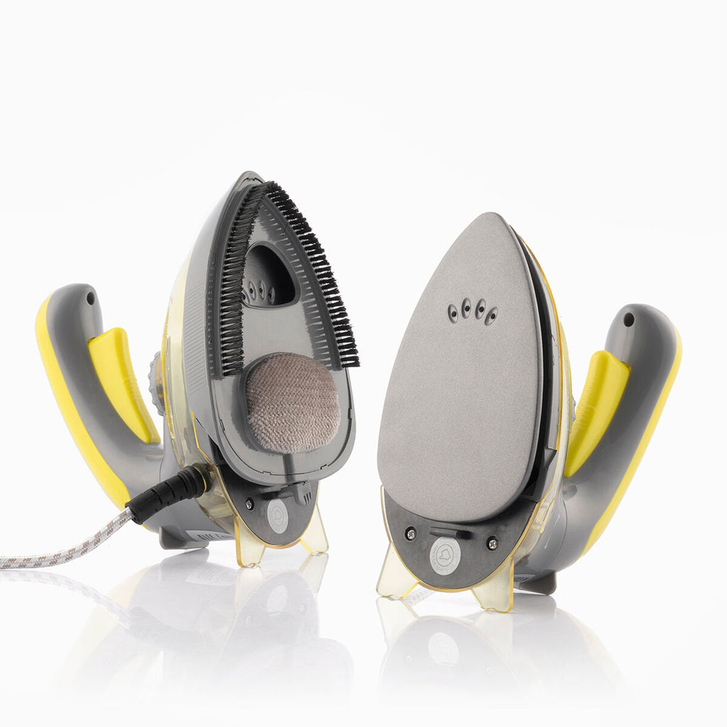 Two-in-one steam iron with visibly detachable components, including a steam brush and a soleplate for versatile ironing. Highlighting the iron’s dual functional capabilities.