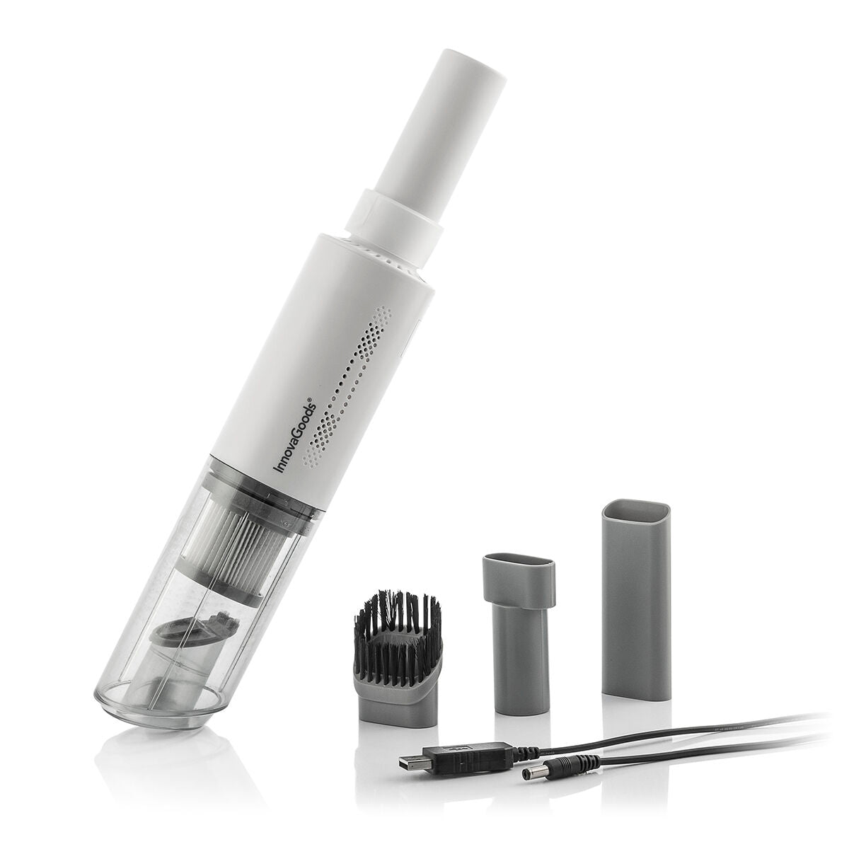 A clean product shot of the handheld vacuum cleaner with its accessories. The vacuum is white with a transparent dust compartment and includes several gray attachments and a charging cable. The setting is against a simple, light background.