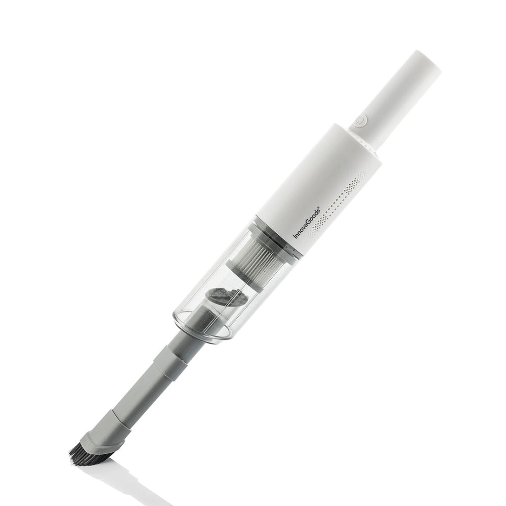 The handheld vacuum cleaner is presented using its full extension. The white product with a transparent dust compartment and gray detailing is against a gradient background, showcasing its sleek and modern design.