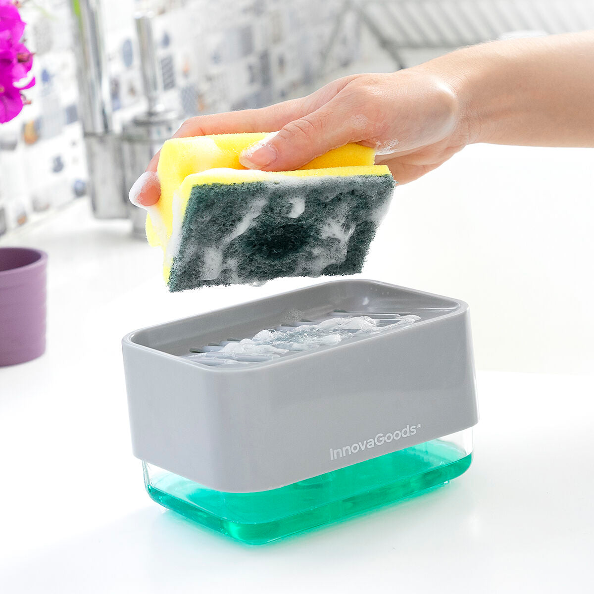 A close-up of the InnovaGoods Pushoap 2-in-1 Soap Dispenser being used with a sponge, showing how the product dispenses soap onto the sponge effectively.