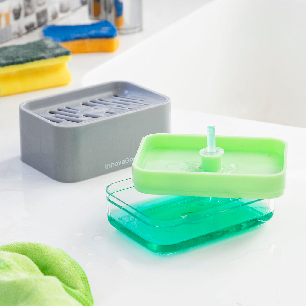 The separate components of the InnovaGoods Pushoap 2-in-1 Soap Dispenser are shown, detailing its assembly and refill process. The gray top part and green-filled transparent bottom part are distinctly displayed.