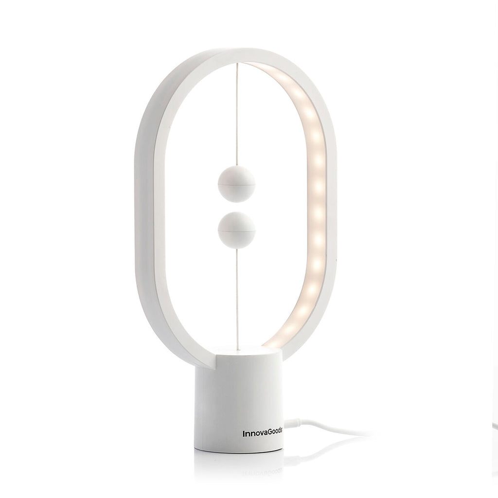Detailed view of the InnovaGoods Balance Lamp, showcasing the LED lights within the oval structure, revealing its sleek design and illumination pattern.