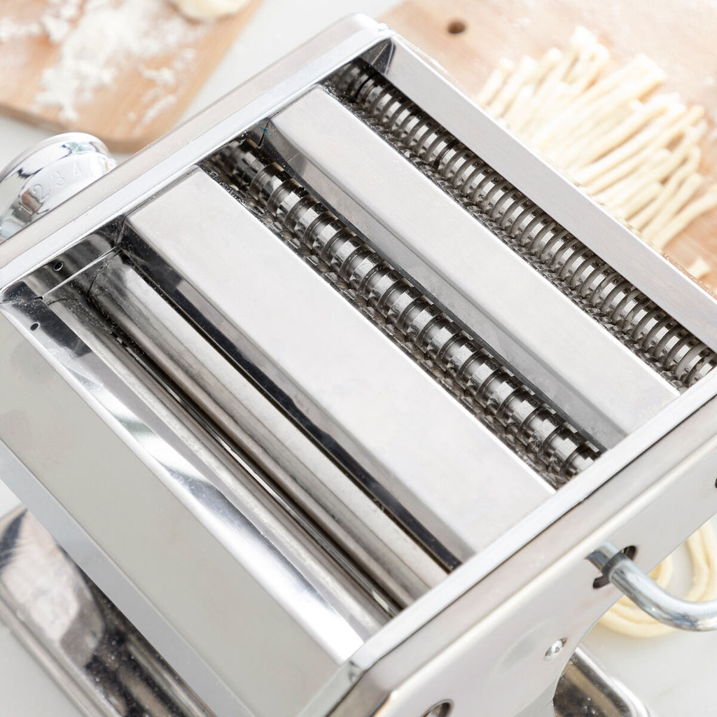 Top view of the rollers within the pasta maker, demonstrating its mechanical parts and structure.