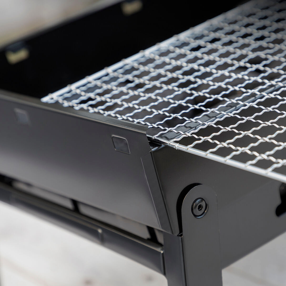 A close-up image focusing on the grill mesh and edge design, showcasing quality and detail.