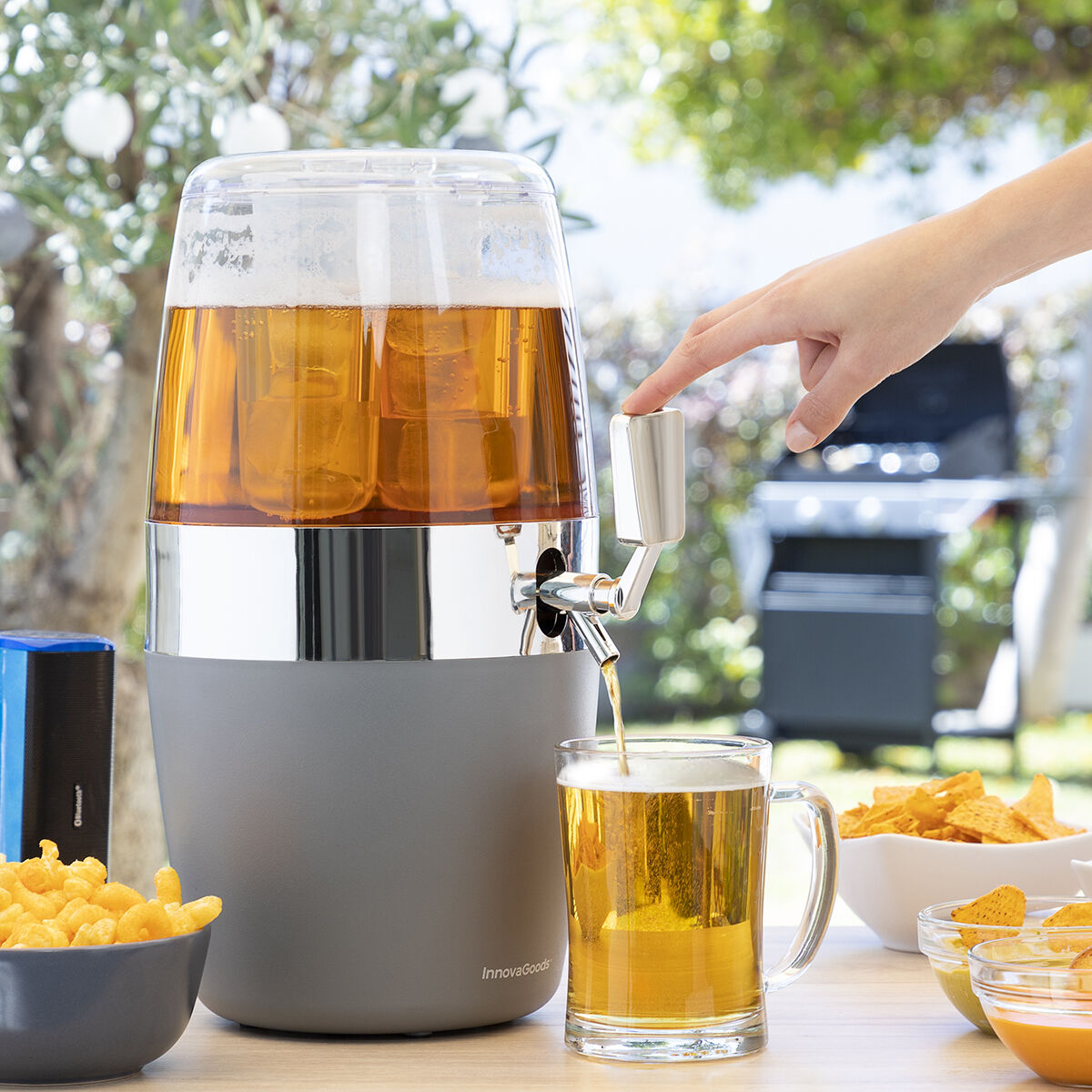 Outside setting with a close-up of the dispenser being used to pour a drink, showcasing the tap function.