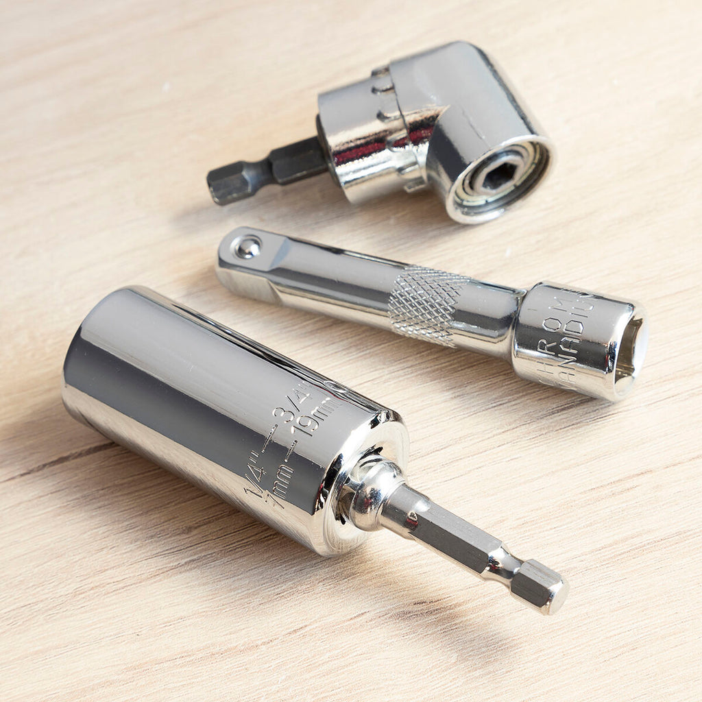 Close-up of the socket wrench and accessories on a wooden surface, emphasizing the chrome materials.