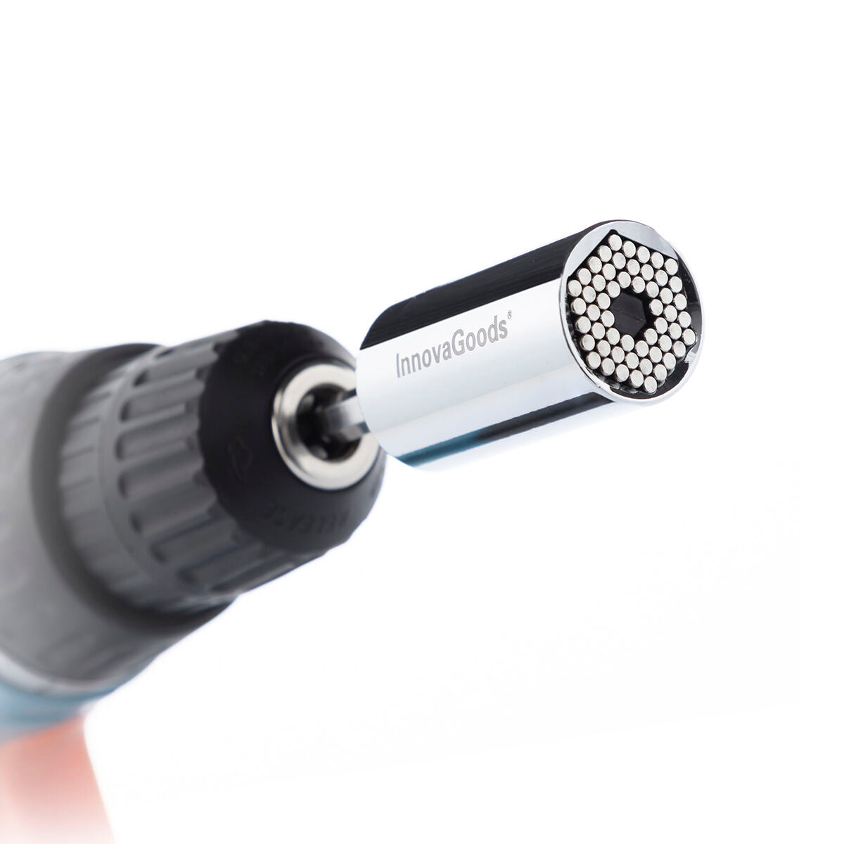 The socket wrench being attached to a drill, highlighting the seamless connection and chrome finish.