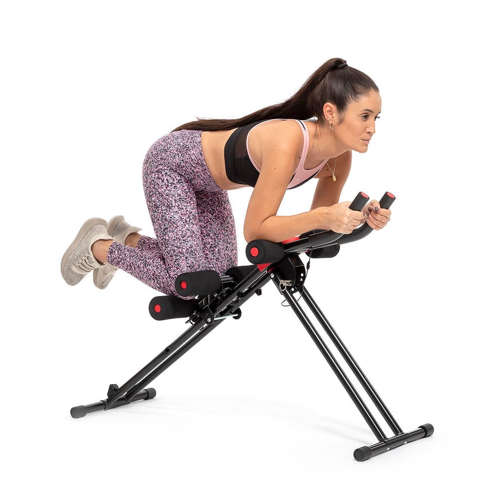 A woman in athletic clothing using the machine. The image shows the practicality of the machine in a workout setting.