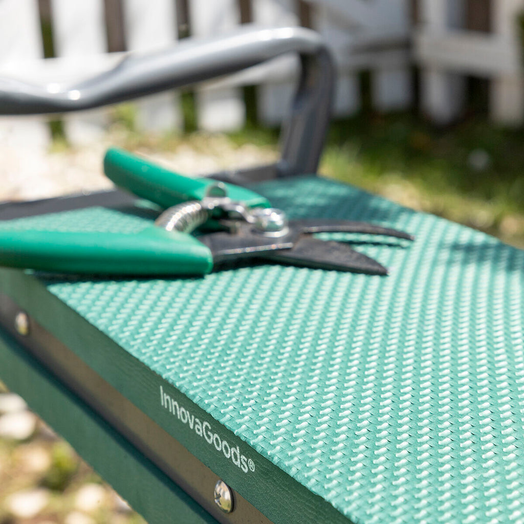 Close-up of a woman holding a buckle clasp associated with the tool bag.