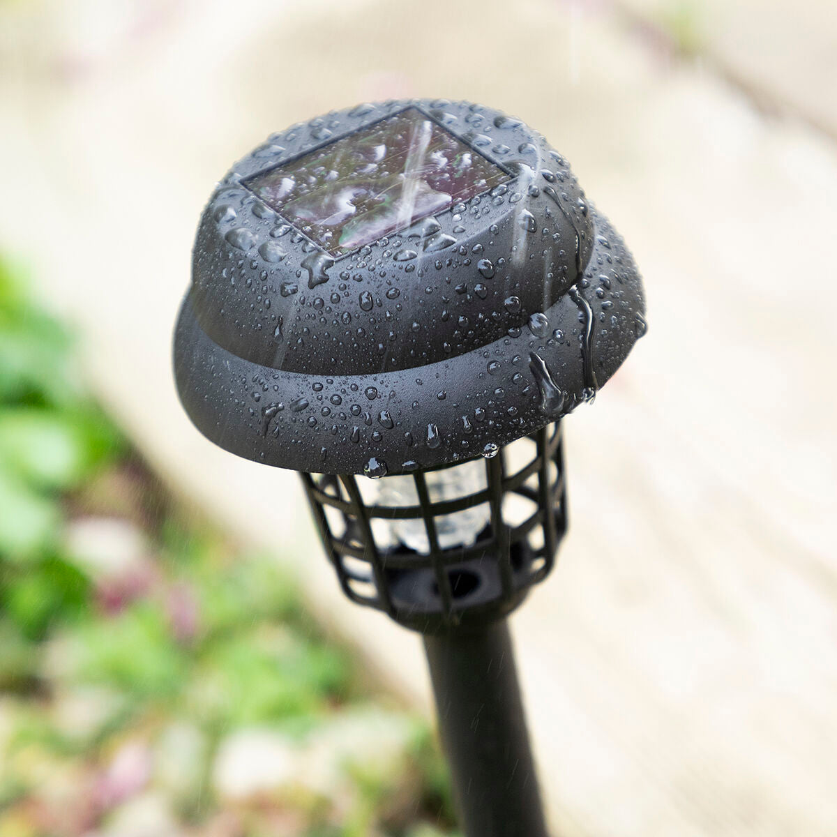 Two lamps illuminated in a garden at dusk, demonstrating the attractiveness and effectiveness in groups for pathways.