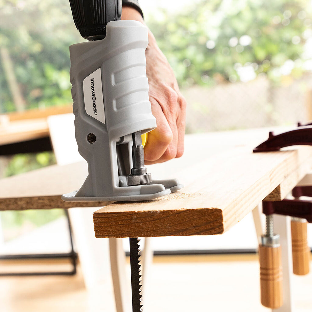 The product cutting a wooden board, focusing on the stability and effectiveness of the tool in a real-world application such as carpentry.