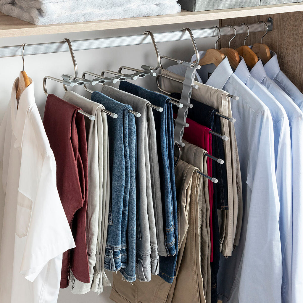 Full view of hanger with trousers hanging vertically in a closet, displaying maximum efficiency.