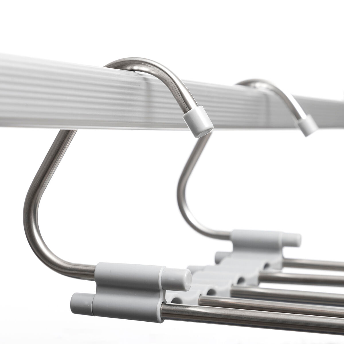 Close-up of hanger's metallic hooks and bars, displaying its sleek design.