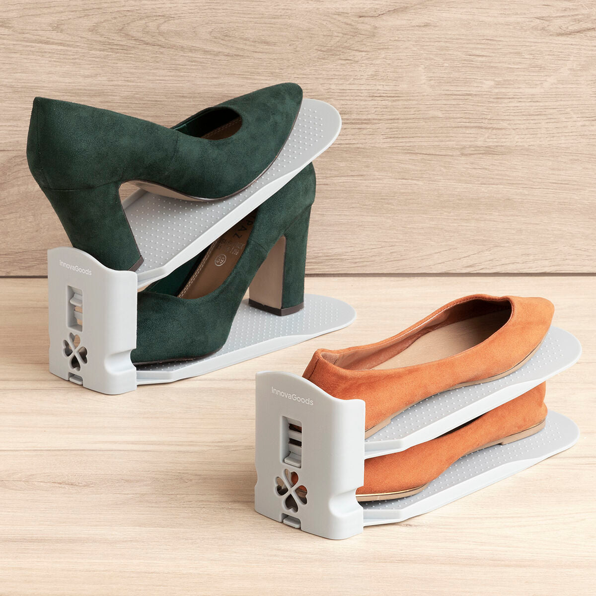 A neat arrangement of two organizers displaying green low heels and orange flats. The gray has a soothing aesthetic, matched with the wooden background platelets.