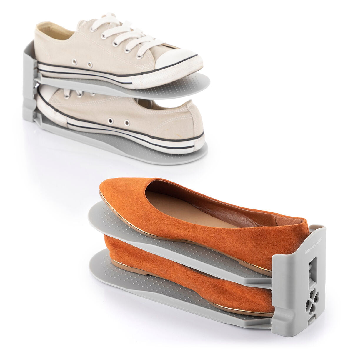 Close-up view of two shoe organizers holding a pair of sneakers and flats. The image focuses on the aesthetic appeal and practical design, showing the adjustable levels and firm hold of the gray organizers.