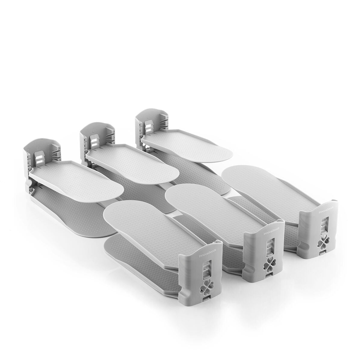 Multiple shoe organizers are displayed in a neatly arranged layout, illustrating their expandability and capability of holding different shoe styles. The organizers, in their signature gray color, emphasize organization and tidiness.