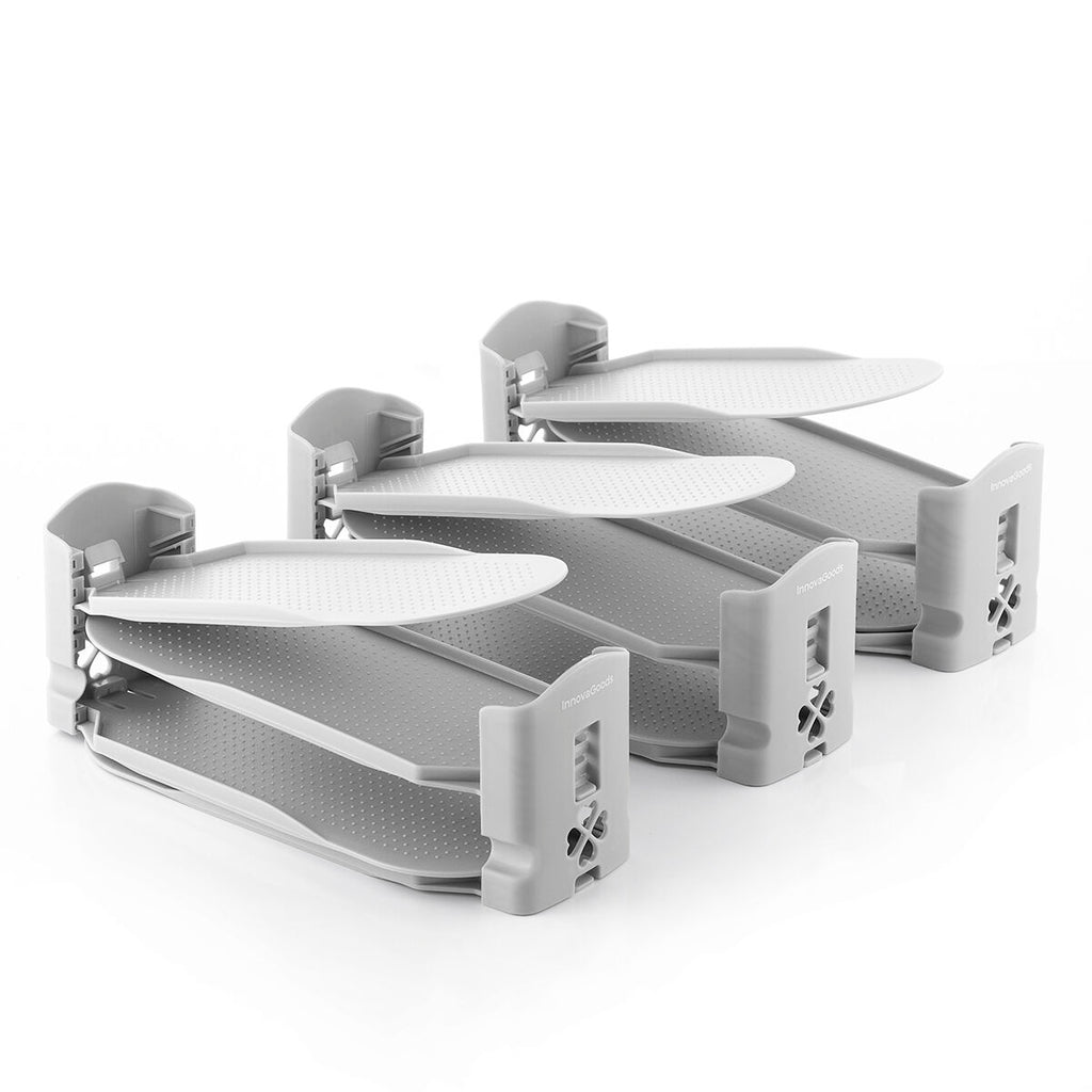 A clean product shot of multiple shoe organizers, highlighting their stackable feature with adjustable levels. The organizers are all gray and display the InnovaGoods brand, showing them in a pristine state for clear visualization.