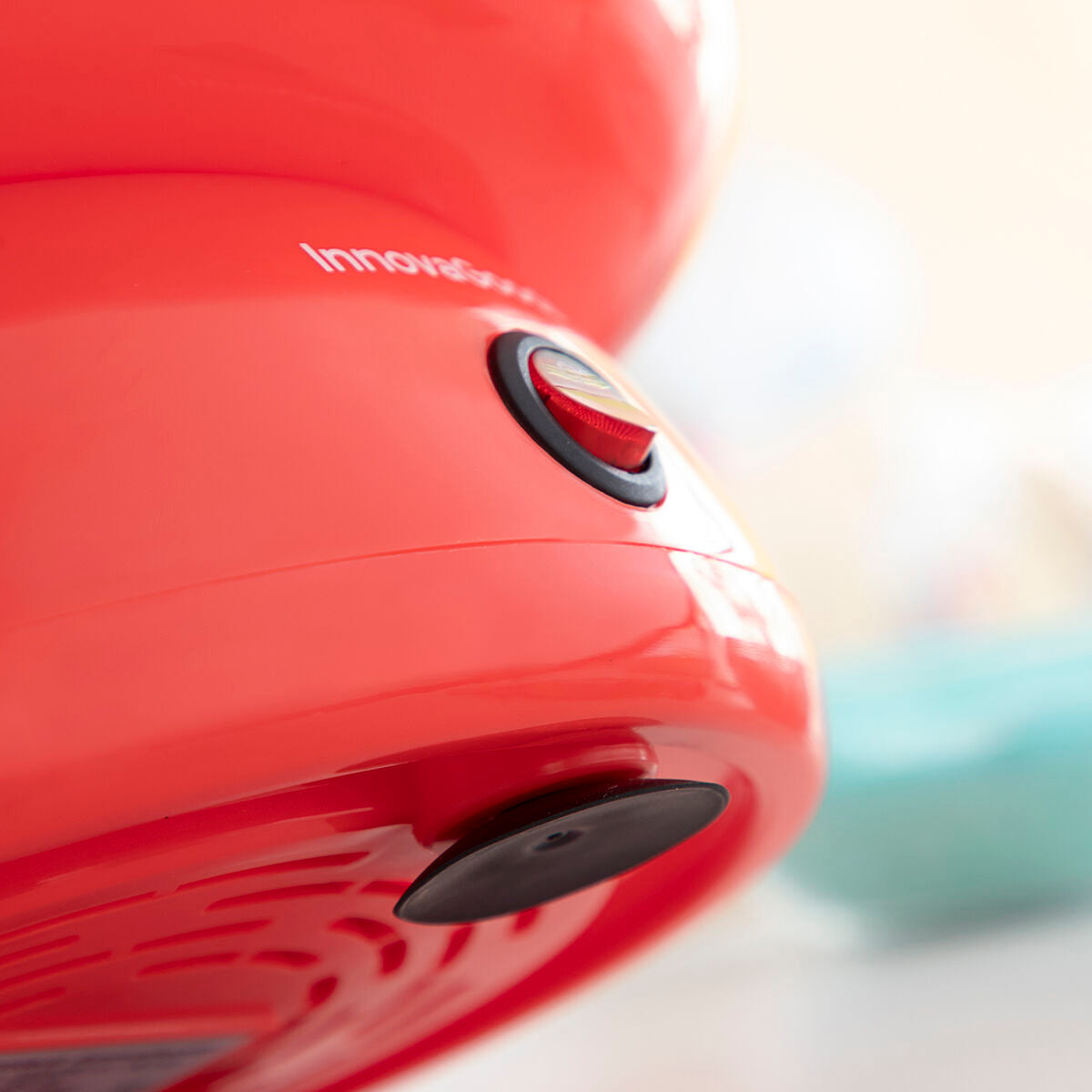 A detailed angled view of the power button on the Candy Floss Machine Cantty InnovaGoods, highlighting the texture and switch functionality.