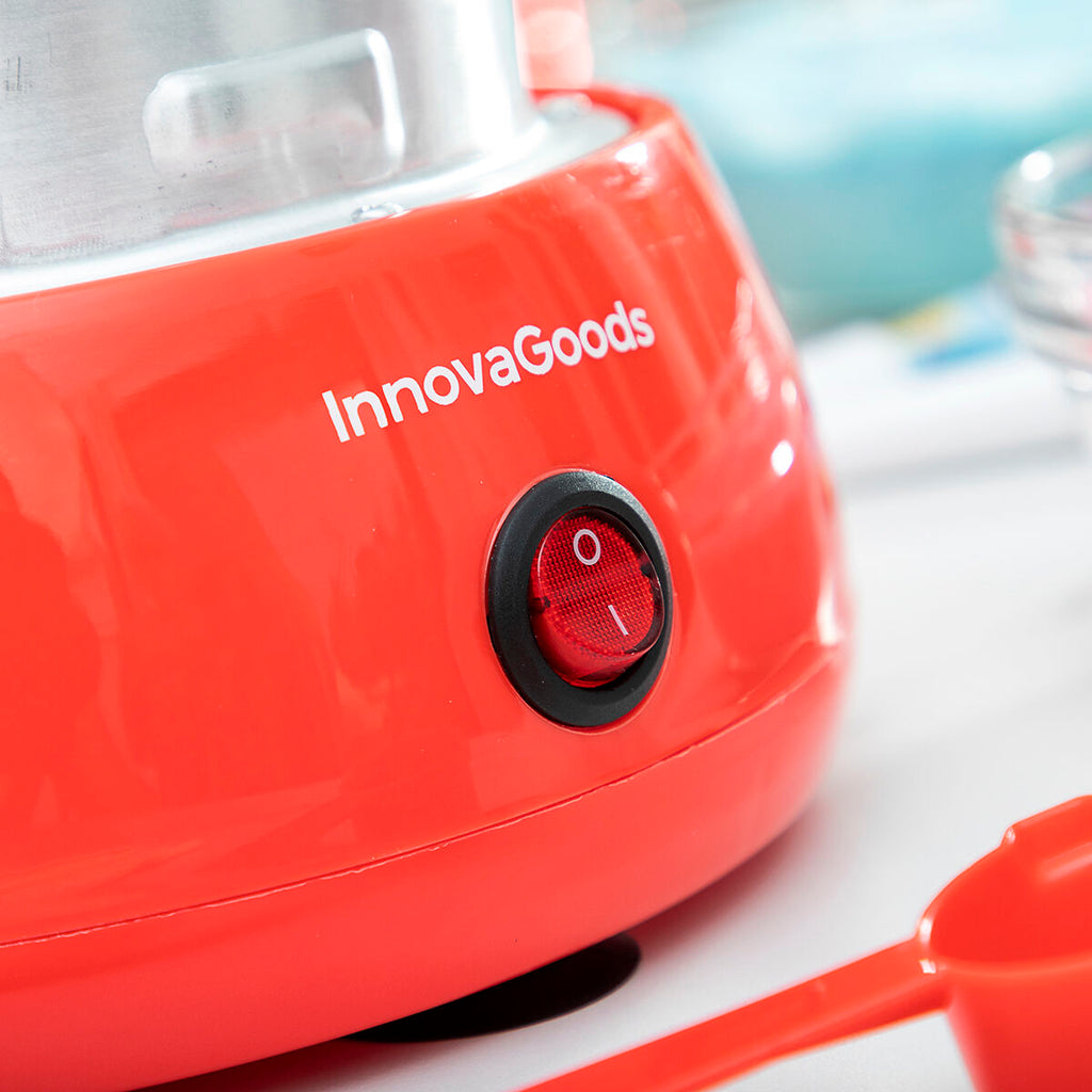 Close-up of the power button on the red base of the Candy Floss Machine Cantty InnovaGoods, showing detailed branding and material texture.