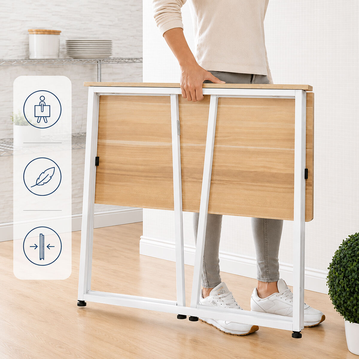 The desk in its folded position being carried by a person, emphasizing portability.