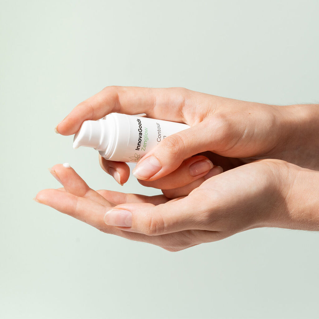 Product being dispensed into a person's hand, highlighting texture and usage. Soft green background complements the scene.