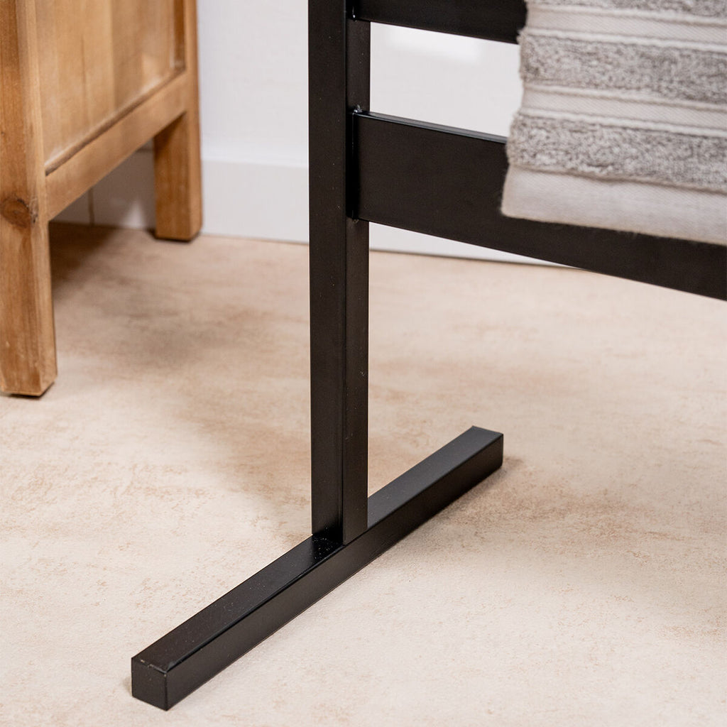 Close-up of the towel rail’s supporting base, showing the robust metal construction.