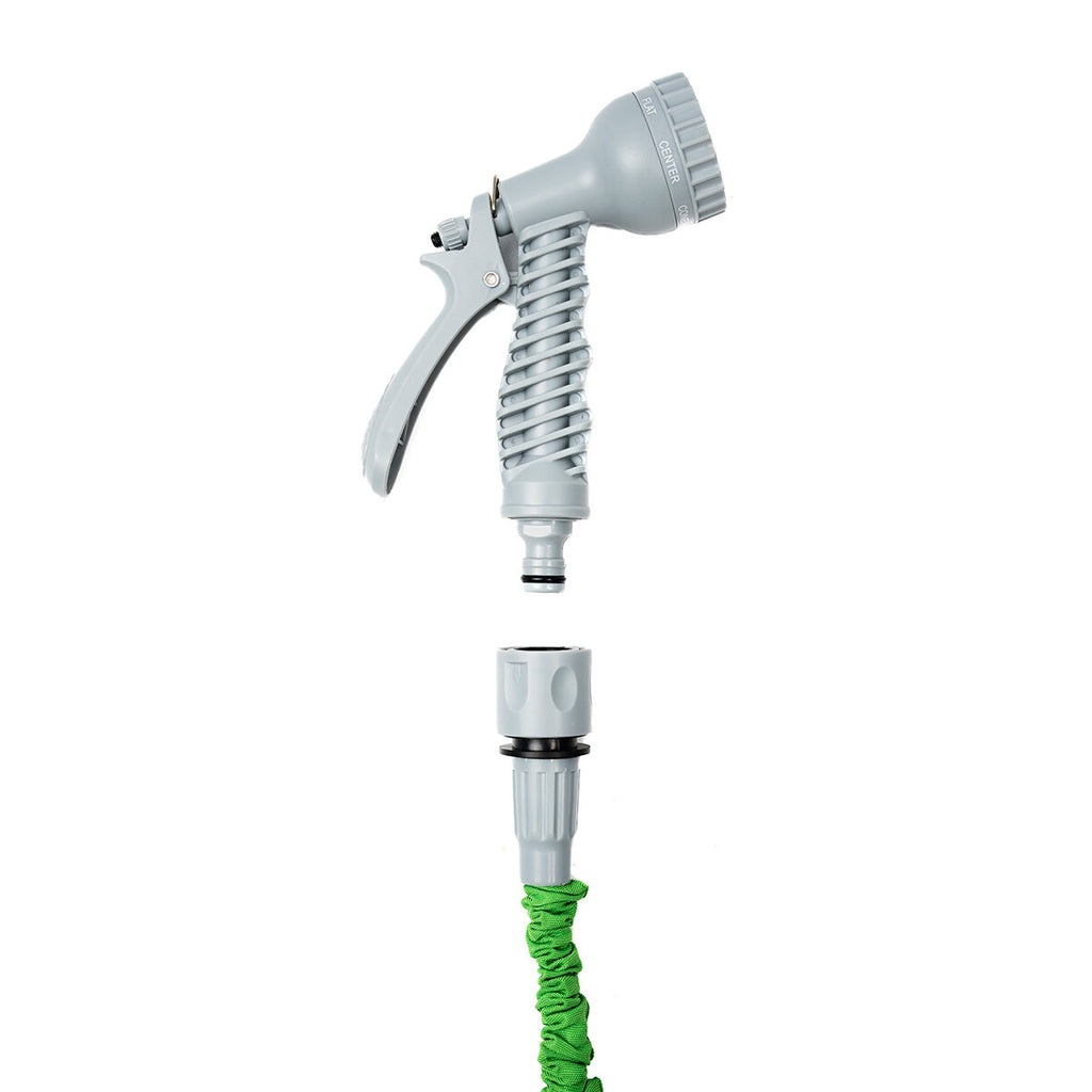 The grey spray nozzle is seen above the green hose, showing the easy attachment system. The nozzle is designed for efficient and ergonomic handling.