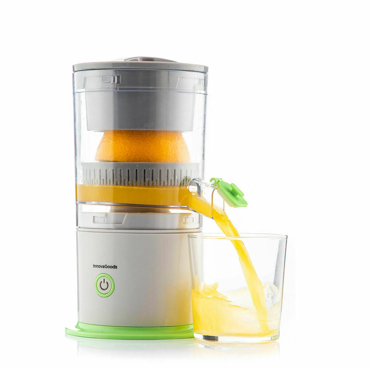 Juicer with orange halves extracting juice into a glass on a white background.